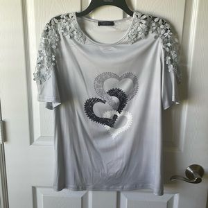 Women’s gray top size large with open trim on sleeves very pretty